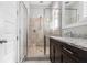 Bathroom featuring a glass shower with tile, granite countertop vanity, and modern fixtures at 3371 Dogwood Dr # 220, Hapeville, GA 30354