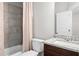 Stylish bathroom featuring a granite vanity, bathtub with tile surround, and neutral color palette at 3371 Dogwood Dr # 220, Hapeville, GA 30354
