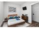 Cozy bedroom with a platform bed and a mounted television at 3371 Dogwood Dr # 220, Hapeville, GA 30354