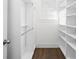 Customized closet with built-in shelves and a window offering ample storage space and organization at 3371 Dogwood Dr # 220, Hapeville, GA 30354