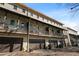 Exterior view of townhomes featuring balconies and garage parking in a charming neighborhood at 3371 Dogwood Dr # 220, Hapeville, GA 30354