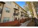 Exterior view of townhomes with brick retaining walls and small balconies at 3371 Dogwood Dr # 220, Hapeville, GA 30354