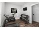 Well-equipped home gym with treadmill, weights, and mounted TV at 3371 Dogwood Dr # 220, Hapeville, GA 30354
