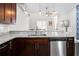 Open kitchen view showcases granite countertops, stainless steel appliances, stylish lighting, and convenient access to living area at 3371 Dogwood Dr # 220, Hapeville, GA 30354