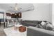 Open-concept living room featuring plush gray sectional sofa and modern ceiling fan at 3371 Dogwood Dr # 220, Hapeville, GA 30354