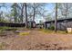 Spacious backyard featuring a storage shed, lush landscaping, and a privacy fence at 2382 Whites Mill Ln, Decatur, GA 30032