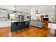 Spacious open-concept kitchen and living area with hardwood floors, modern appliances, and ample natural light at 2382 Whites Mill Ln, Decatur, GA 30032