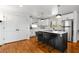 Modern kitchen with a large island, stainless steel appliances, pendant lighting, and white cabinetry at 2382 Whites Mill Ln, Decatur, GA 30032