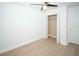 Bright bedroom featuring hardwood floors, a ceiling fan, and a closet at 5740 Terremont Cir, Norcross, GA 30093