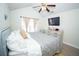 Comfortable bedroom with light gray bedding and window treatments for privacy and style at 5740 Terremont Cir, Norcross, GA 30093