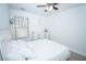 Inviting bedroom with plush white bedding, bright window, and ample natural light at 5740 Terremont Cir, Norcross, GA 30093