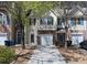 Charming townhome featuring a single-car garage and a well-maintained front yard at 5740 Terremont Cir, Norcross, GA 30093