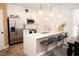 Modern kitchen featuring sleek stainless steel appliances and an eat-in island at 5740 Terremont Cir, Norcross, GA 30093