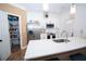 Modern kitchen with white cabinets, stainless steel appliances, and a large pantry at 5740 Terremont Cir, Norcross, GA 30093