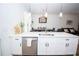 Kitchen featuring white cabinets, an eat-in island, and stainless steel appliances at 5740 Terremont Cir, Norcross, GA 30093