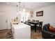 Bright kitchen with a quartz countertop island with bar stool seating and an adjacent dining area at 5740 Terremont Cir, Norcross, GA 30093