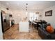 Modern kitchen featuring stainless steel appliances, large island, and adjacent dining area at 5740 Terremont Cir, Norcross, GA 30093