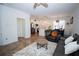 Open-concept living room with a sleek kitchen featuring modern appliances and a spacious layout at 5740 Terremont Cir, Norcross, GA 30093