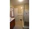 Bathroom featuring tile flooring, walk-in shower, and vanity sink at 1075 Winding Branch Ln, Atlanta, GA 30338