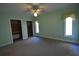 Bedroom with ceiling fan, windows, and closets at 1075 Winding Branch Ln, Atlanta, GA 30338