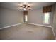 Large bedroom with ceiling fan and two windows at 1075 Winding Branch Ln, Atlanta, GA 30338
