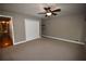 Bedroom with ceiling fan, closet and views to hallway at 1075 Winding Branch Ln, Atlanta, GA 30338