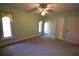 Bedroom with natural light, a ceiling fan, and neutral color scheme at 1075 Winding Branch Ln, Atlanta, GA 30338