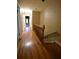 Upstairs hallway boasts wood floors and access to rooms at 1075 Winding Branch Ln, Atlanta, GA 30338