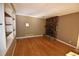 Inviting living room featuring a stone fireplace and built-in shelving at 1075 Winding Branch Ln, Atlanta, GA 30338