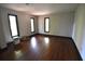 A bright room with hardwood flooring and natural light from large windows at 1075 Winding Branch Ln, Atlanta, GA 30338