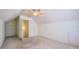 Spacious bedroom with an angled ceiling, a ceiling fan, and a closet at 1312 Birch Ct, Lithonia, GA 30058