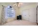Bright, airy bedroom with a desk, lots of closet space, carpet and a ceiling fan at 1312 Birch Ct, Lithonia, GA 30058