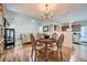 Dining area with hardwood floors and a view into the open concept living room and kitchen at 1312 Birch Ct, Lithonia, GA 30058