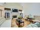 Cozy living room with a fireplace, hardwood floors, vaulted ceilings and natural light at 1312 Birch Ct, Lithonia, GA 30058