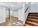 Finished basement with durable flooring, ample space, a support beam, and stairs leading to the upper level at 1328 Sharon Street Nw, Atlanta, GA 30314