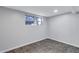 Finished basement area with a bright window and tiled floor at 1328 Sharon Street Nw, Atlanta, GA 30314