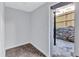 Finished basement with tile flooring and exit to the fenced backyard at 1328 Sharon Street Nw, Atlanta, GA 30314