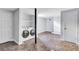View of the basement laundry room with floor tiles and white washer and dryer at 1328 Sharon Street Nw, Atlanta, GA 30314