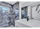 Modern bathroom with onyx style tile, double sinks, walk-in shower, and dark fixtures at 1328 Sharon Street Nw, Atlanta, GA 30314