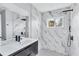 Modern bathroom featuring white marble walls, a walk-in shower, and vanity at 1328 Sharon Street Nw, Atlanta, GA 30314