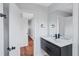 Bathroom with modern fixtures, a sleek vanity, and a large mirror at 1328 Sharon Street Nw, Atlanta, GA 30314