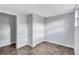 Bedroom with large closet, tile flooring, white walls, and window at 1328 Sharon Street Nw, Atlanta, GA 30314