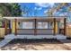 Charming duplex with inviting front porch and updated curb appeal with yellow doors at 1328 Sharon Street Nw, Atlanta, GA 30314