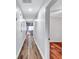 Long hallway with hardwood floors leading to the kitchen at 1328 Sharon Street Nw, Atlanta, GA 30314
