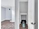 Finished basement hallway with tile flooring leading to storage at 1328 Sharon Street Nw, Atlanta, GA 30314