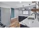 Updated kitchen features stainless steel appliances, kitchen island, and hardwood floors at 1328 Sharon Street Nw, Atlanta, GA 30314