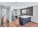 Modern kitchen featuring stainless steel appliances, designer backsplash, and sleek countertops at 1328 Sharon Street Nw, Atlanta, GA 30314