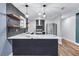 Modern kitchen with stainless appliances, ample counter space, and open layout to living area at 1328 Sharon Street Nw, Atlanta, GA 30314