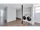 Laundry room with tile flooring, white walls, and new front-loading washer and dryer at 1328 Sharon Street Nw, Atlanta, GA 30314