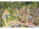 Aerial view of a home with a tree-lined property boundary, long driveway, and two-car garage at 195 Creekside Way, Mcdonough, GA 30252